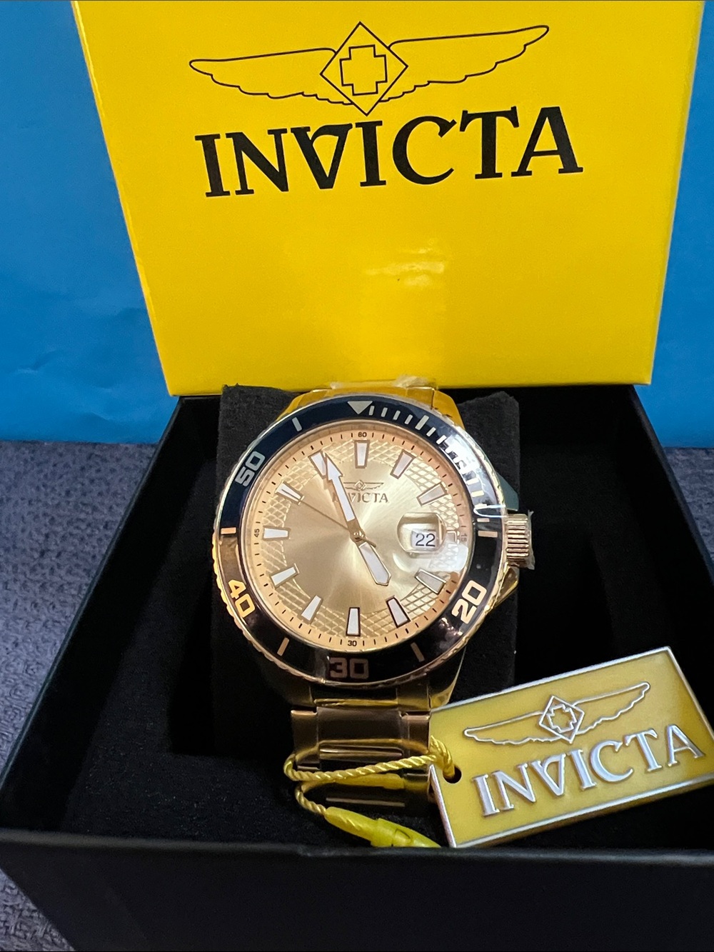Invicta Gold-Tone Watch with Black Bezel and Champagne Dial (Model 46069)
